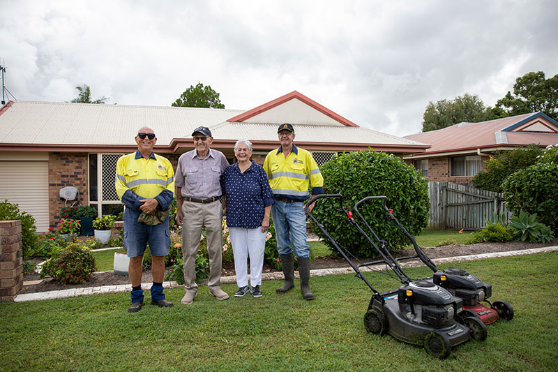 Bundaberg veteran mowing group members with members of the Bundaberg RSL Sub Branch after mowing their lawn. 