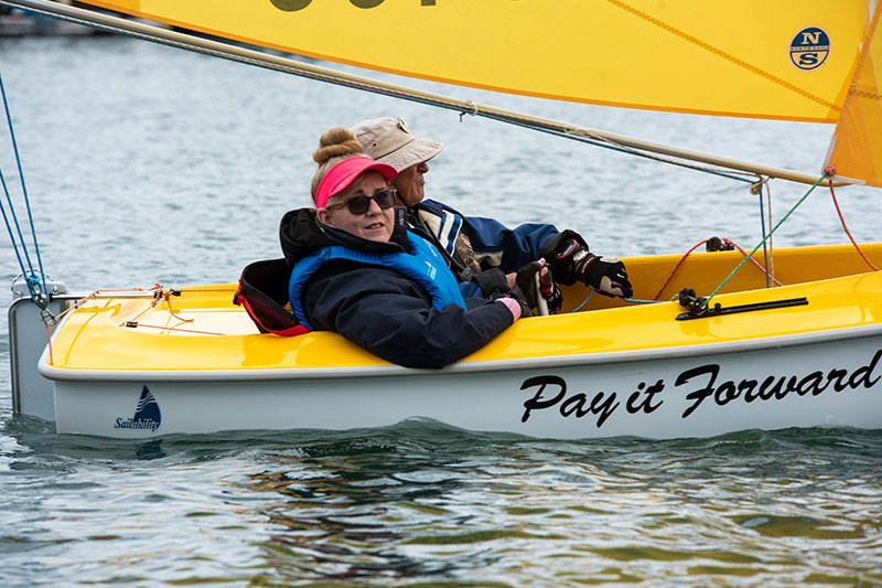 Veteran Sharon Dalton sitting in sail boat. 