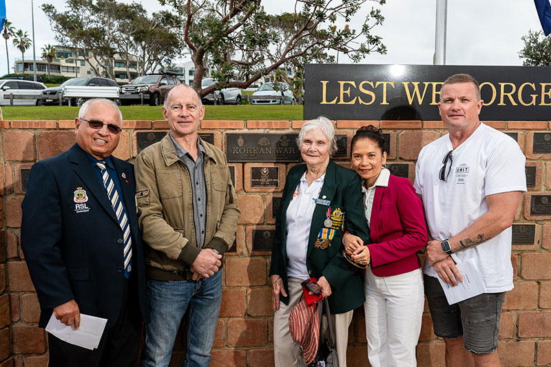Veteran's family in front of korean war memorial
