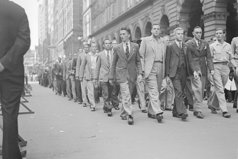 Returned servicemen march past the Cenotaph in Martin Place in Sydney on ANZAC Day 1946. Artist unknown: AWM 127110